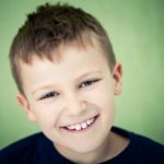 Does Your Child Need Early Orthodontic Treatment? 4 A portrait of a child smiling