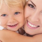 Should You Replace Your Amalgam Fillings? 4 Mother and her daughter smiling together