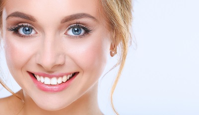 Portrait of a woman smiling on white background