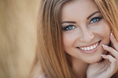 A young woman smiling