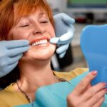 How Dental Implants Can Help Prevent Jawbone Loss 7 Senior woman in the dental office