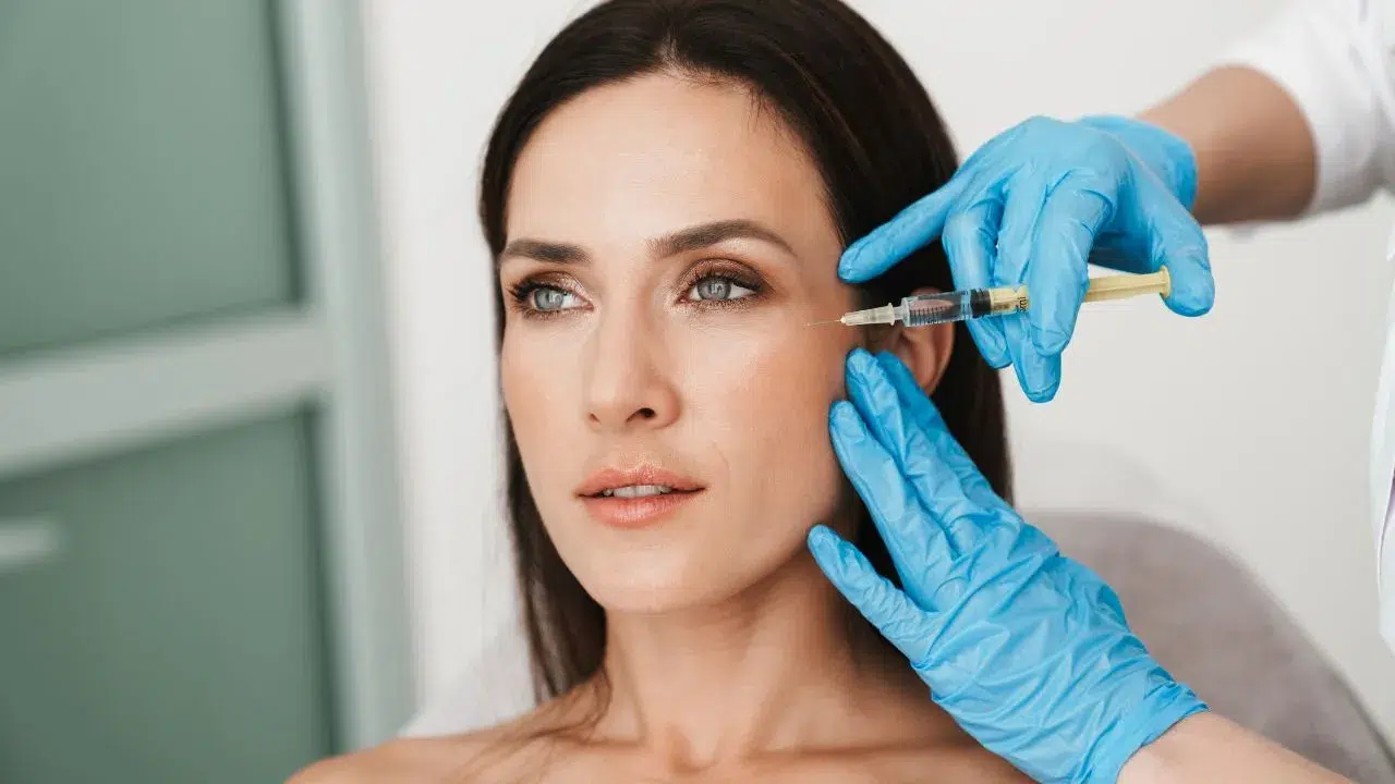 Photo of beautiful woman getting treatment